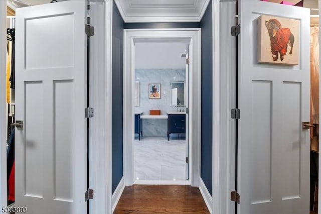 hall with dark hardwood / wood-style floors and crown molding