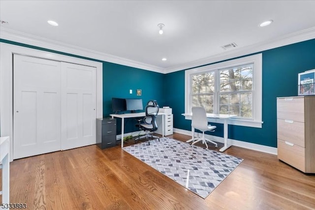 home office featuring hardwood / wood-style flooring and ornamental molding