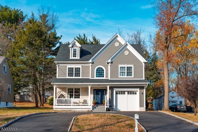 view of front of property with a garage and a porch