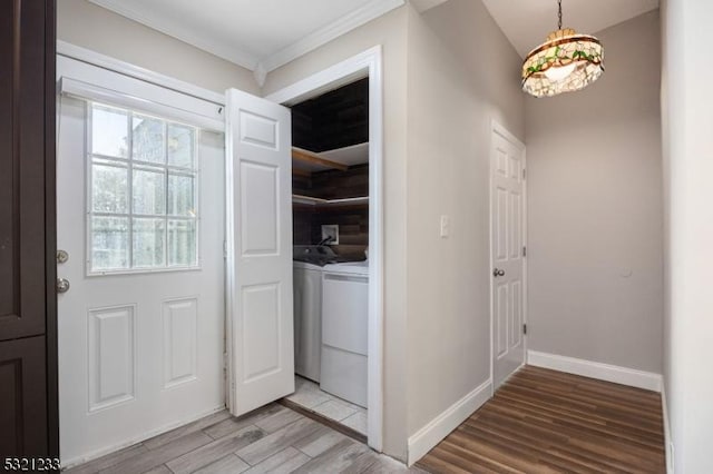 entrance foyer with separate washer and dryer and light hardwood / wood-style flooring