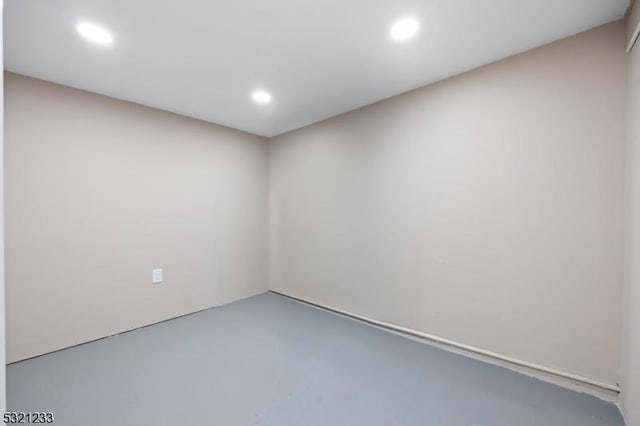 unfurnished room featuring concrete flooring