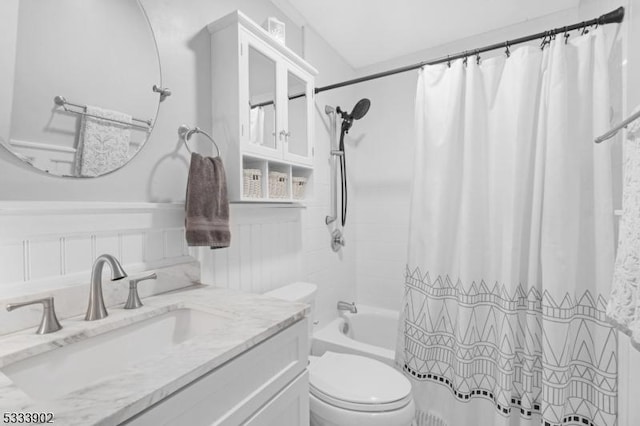 full bathroom featuring vanity, toilet, and shower / bath combo with shower curtain