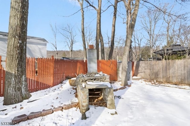 view of yard layered in snow