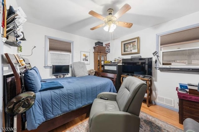 bedroom featuring ceiling fan and wood-type flooring