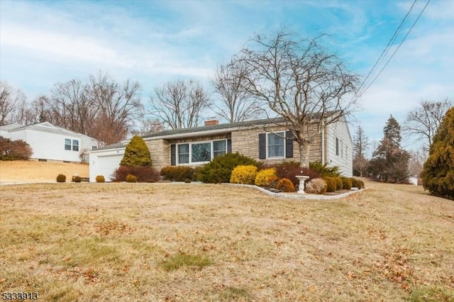 view of side of home with a garage and a yard