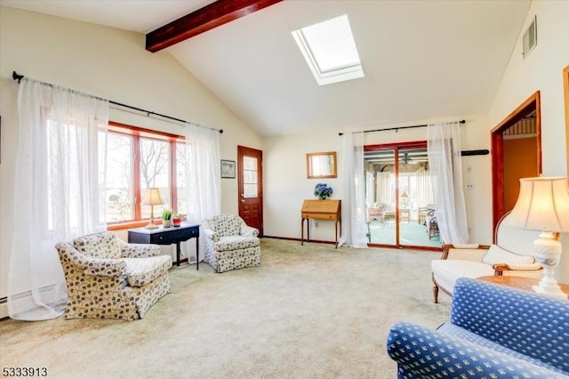 living area featuring vaulted ceiling with skylight and carpet