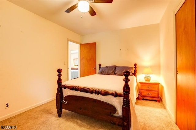 bedroom with light carpet and ceiling fan