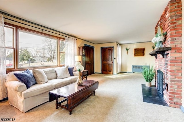 carpeted living room featuring a brick fireplace and crown molding