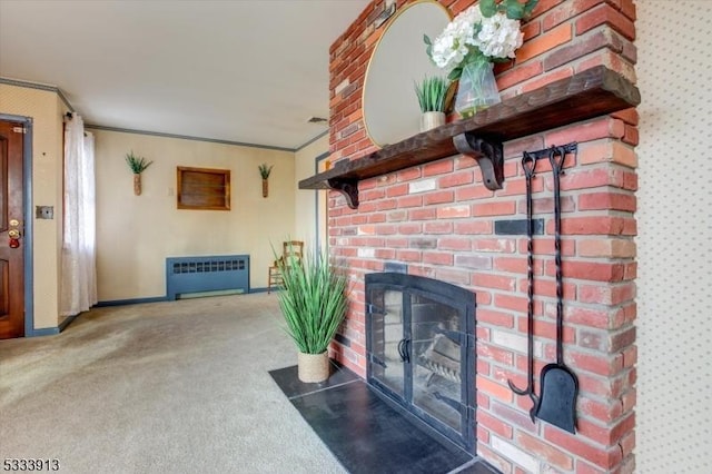 living room featuring a fireplace, radiator heating unit, carpet floors, and ornamental molding