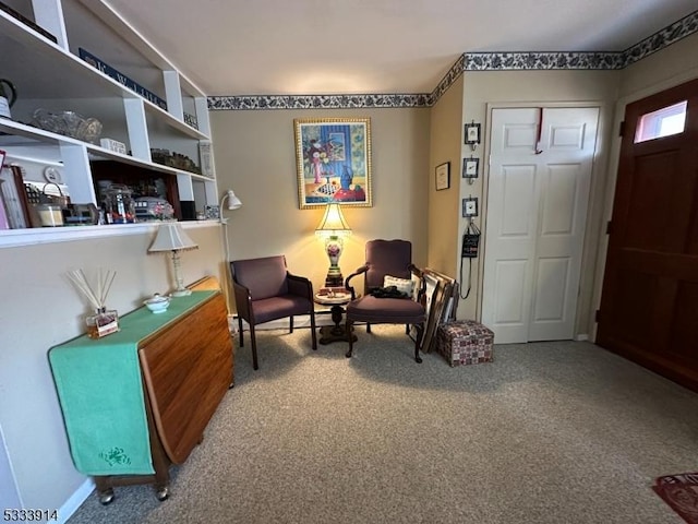 sitting room with carpet flooring