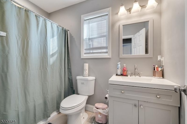 bathroom with vanity, a shower with shower curtain, tile patterned floors, and toilet