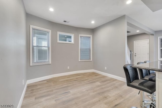 office with light hardwood / wood-style flooring