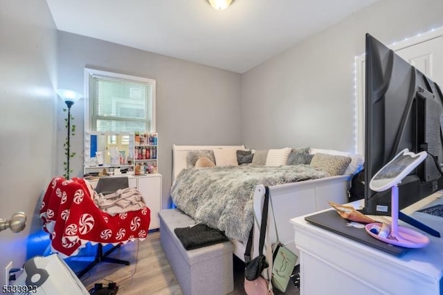 bedroom with light wood-type flooring