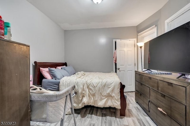 bedroom with light hardwood / wood-style floors