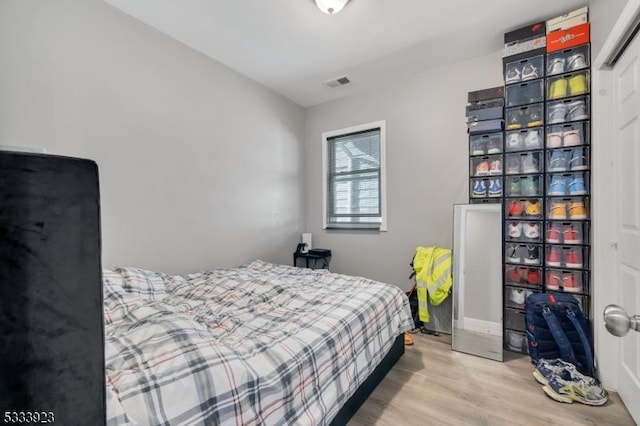 bedroom with wood-type flooring