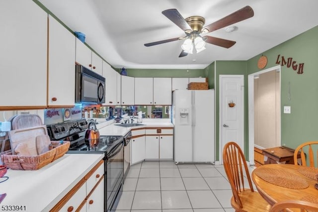 kitchen featuring light tile patterned flooring, white cabinets, ceiling fan, and black appliances