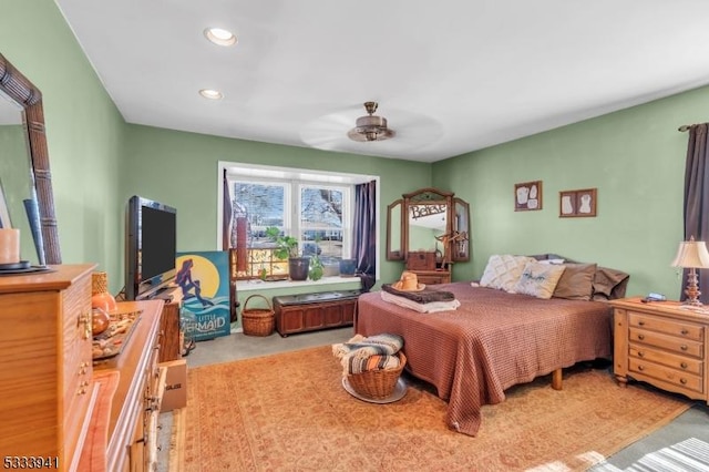 bedroom with light carpet and ceiling fan