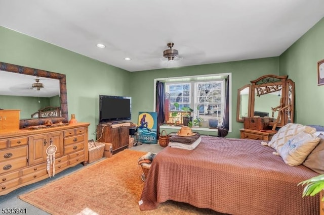 carpeted bedroom with ceiling fan