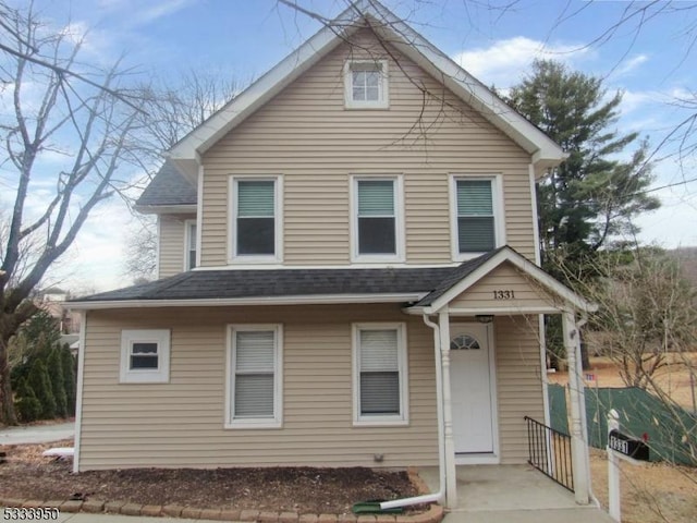 view of front of home featuring roof with shingles