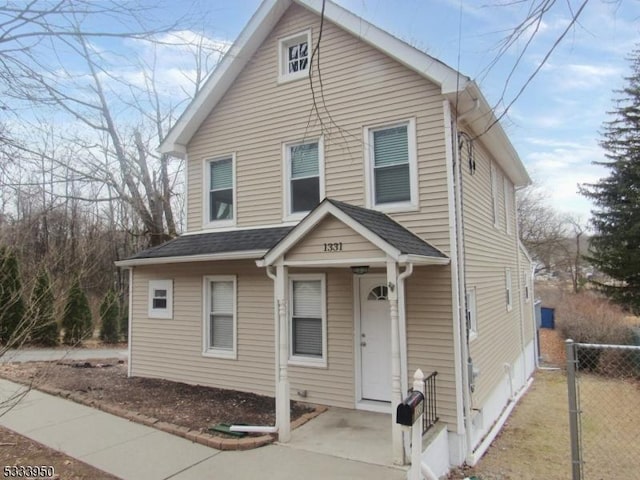 view of front of home with fence
