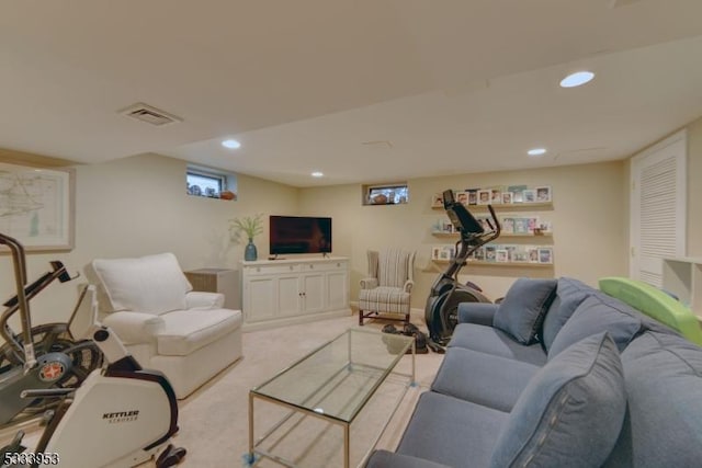 living room featuring recessed lighting, visible vents, and light carpet