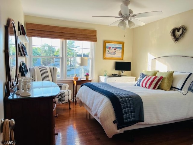 bedroom with ceiling fan and wood finished floors