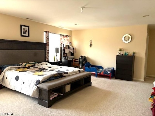 bedroom featuring light colored carpet