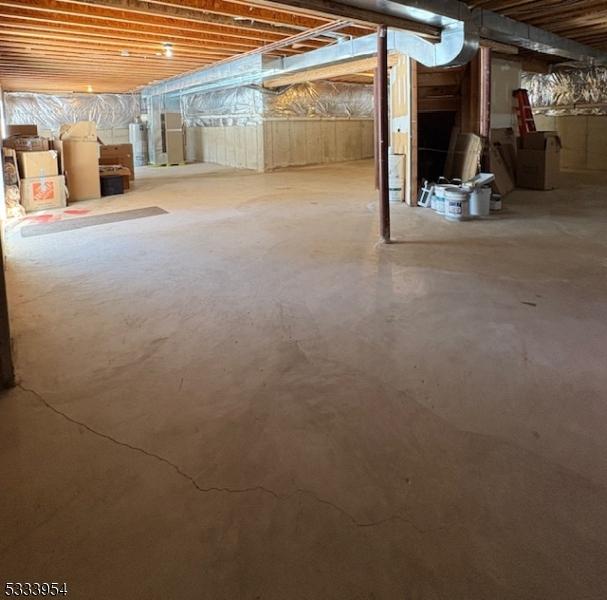 basement featuring gas water heater