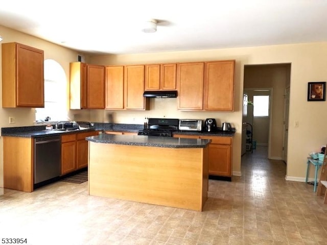 kitchen with sink, a kitchen island, dishwasher, and range