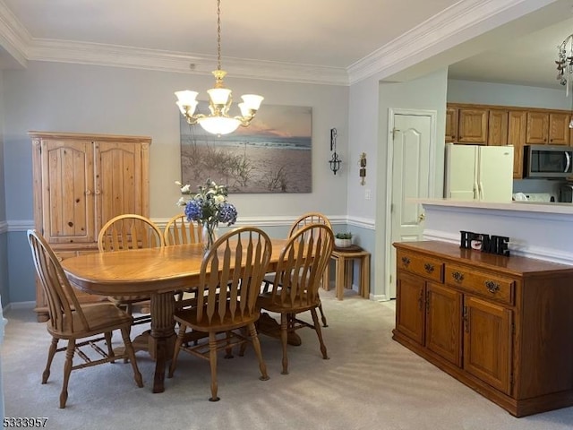 dining area with ornamental molding, light colored carpet, and a notable chandelier