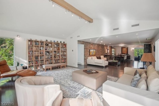 living room with beamed ceiling, track lighting, wood-type flooring, and high vaulted ceiling