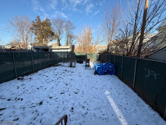 view of yard layered in snow