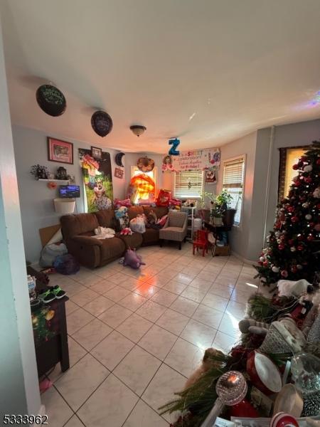 recreation room with light tile patterned floors