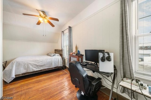 bedroom featuring vaulted ceiling, wood-type flooring, and ceiling fan