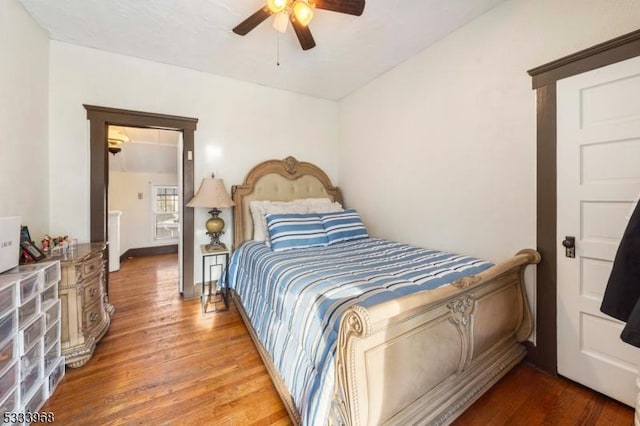 bedroom with hardwood / wood-style flooring and ceiling fan