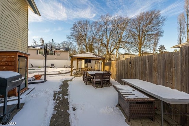 yard layered in snow featuring a gazebo