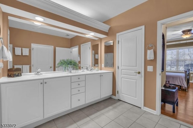 bathroom with ceiling fan, tile patterned floors, and vanity