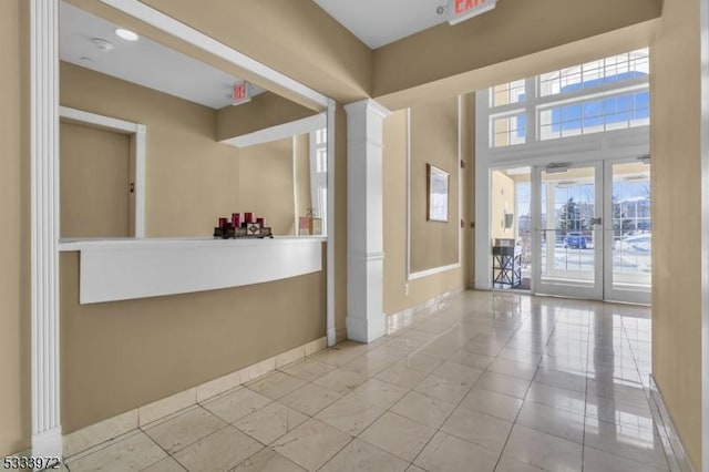 reception with ornate columns and french doors