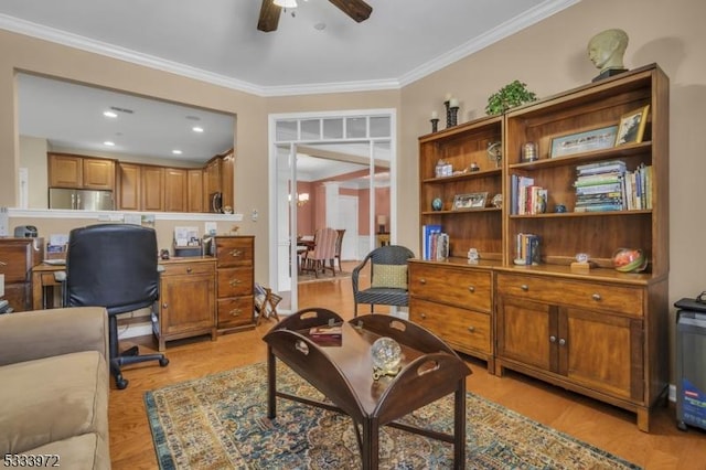 office space with ceiling fan, ornamental molding, and light hardwood / wood-style floors