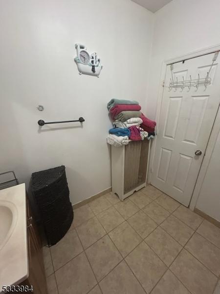 bathroom featuring tile patterned flooring and vanity