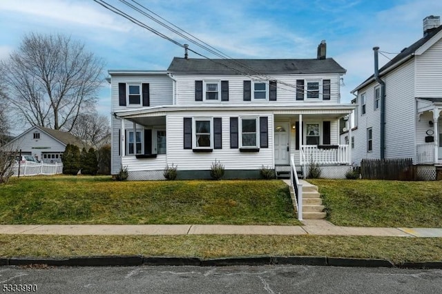 view of front of house with covered porch and a front yard