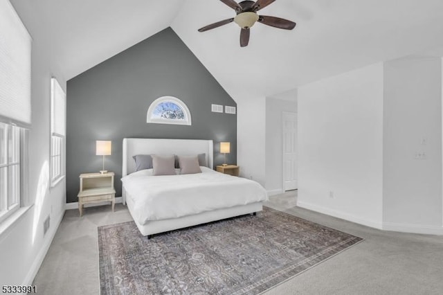 bedroom featuring ceiling fan, carpet flooring, and high vaulted ceiling