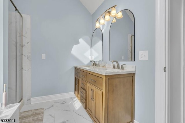 bathroom with lofted ceiling, vanity, and walk in shower