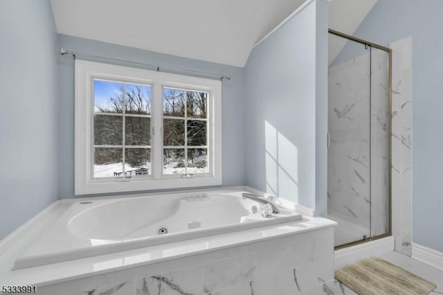 bathroom with independent shower and bath and vaulted ceiling