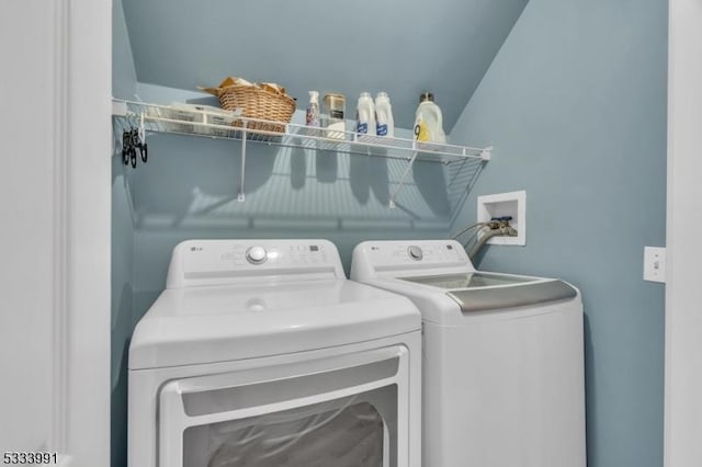 washroom featuring washer and dryer