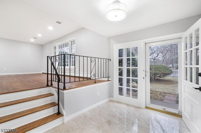 doorway to outside with a baseboard heating unit