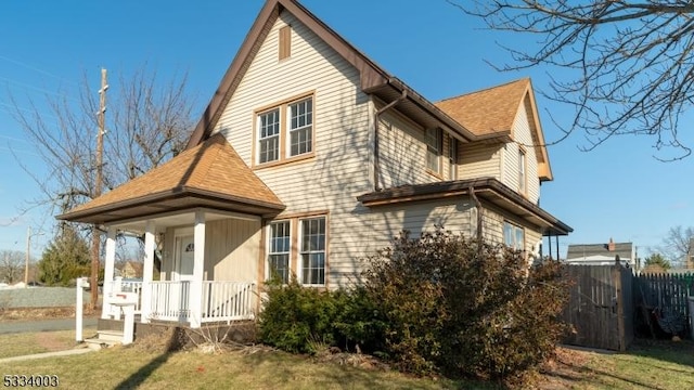 view of property exterior with a yard