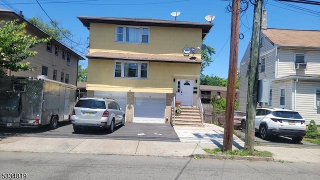 front of property with a garage