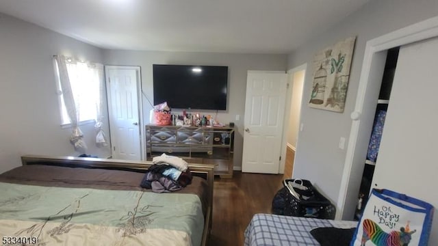 bedroom featuring dark wood-type flooring