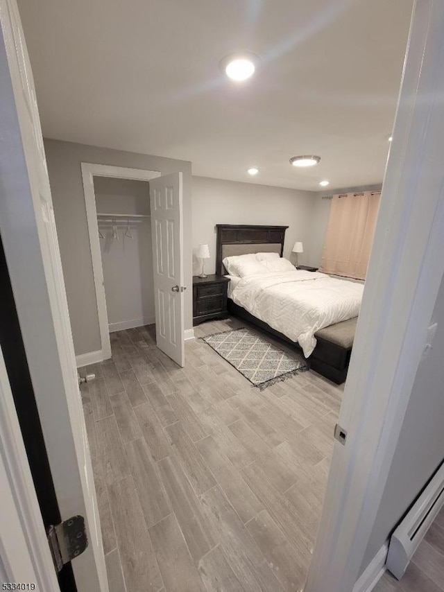 unfurnished bedroom with a closet and wood-type flooring